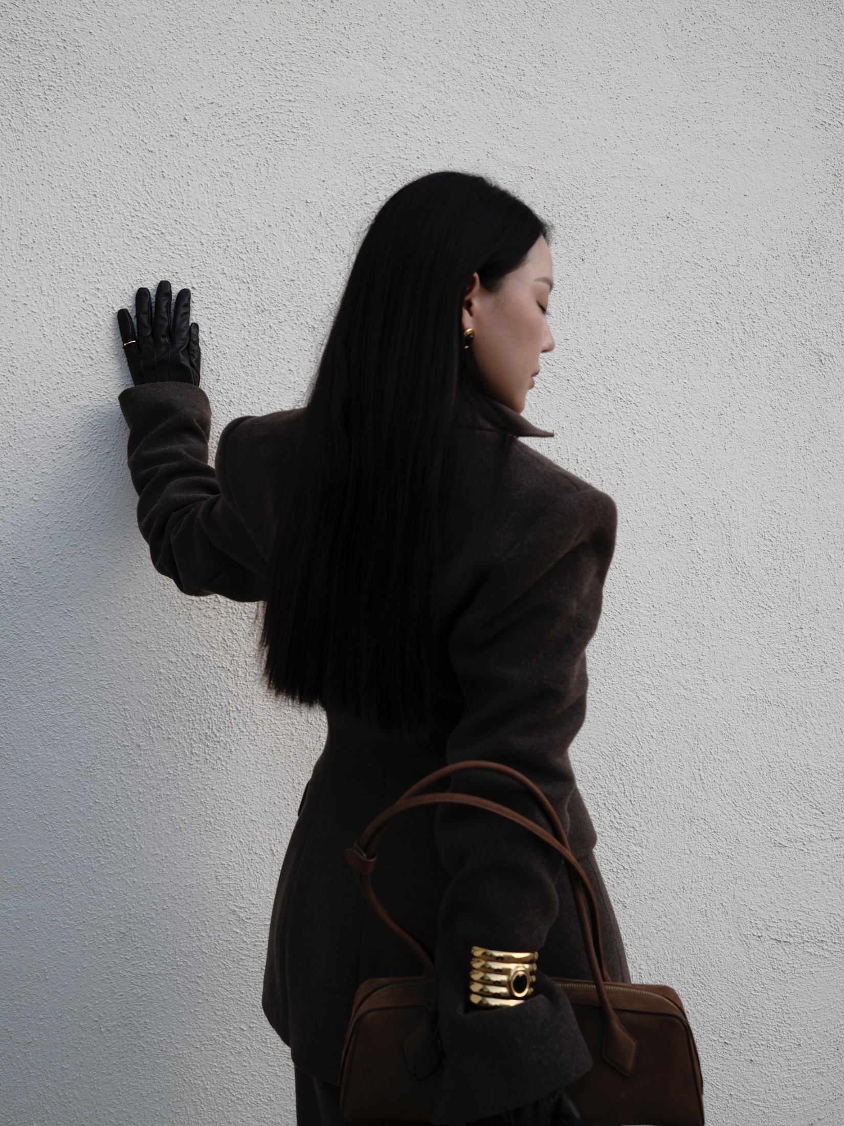 Brown tailoring with suede-toned bag and glove detail