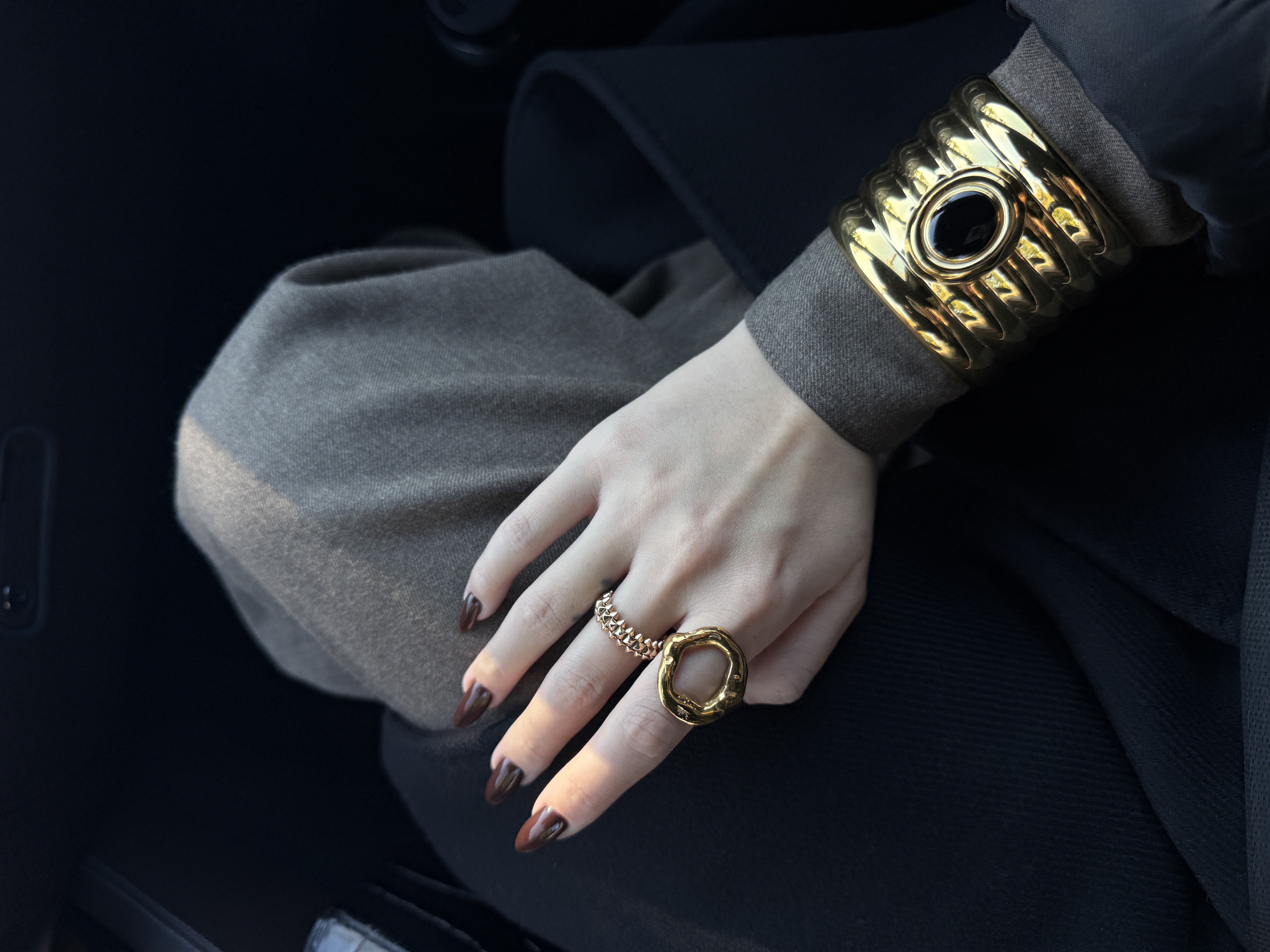 Gold cuff and hand detail