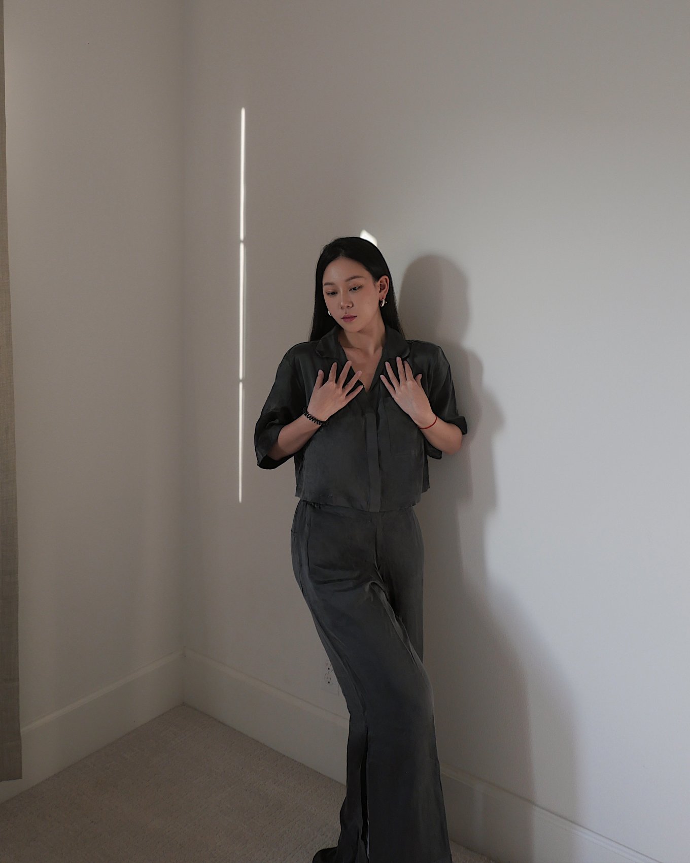 Lunya charcoal silk set in soft natural light