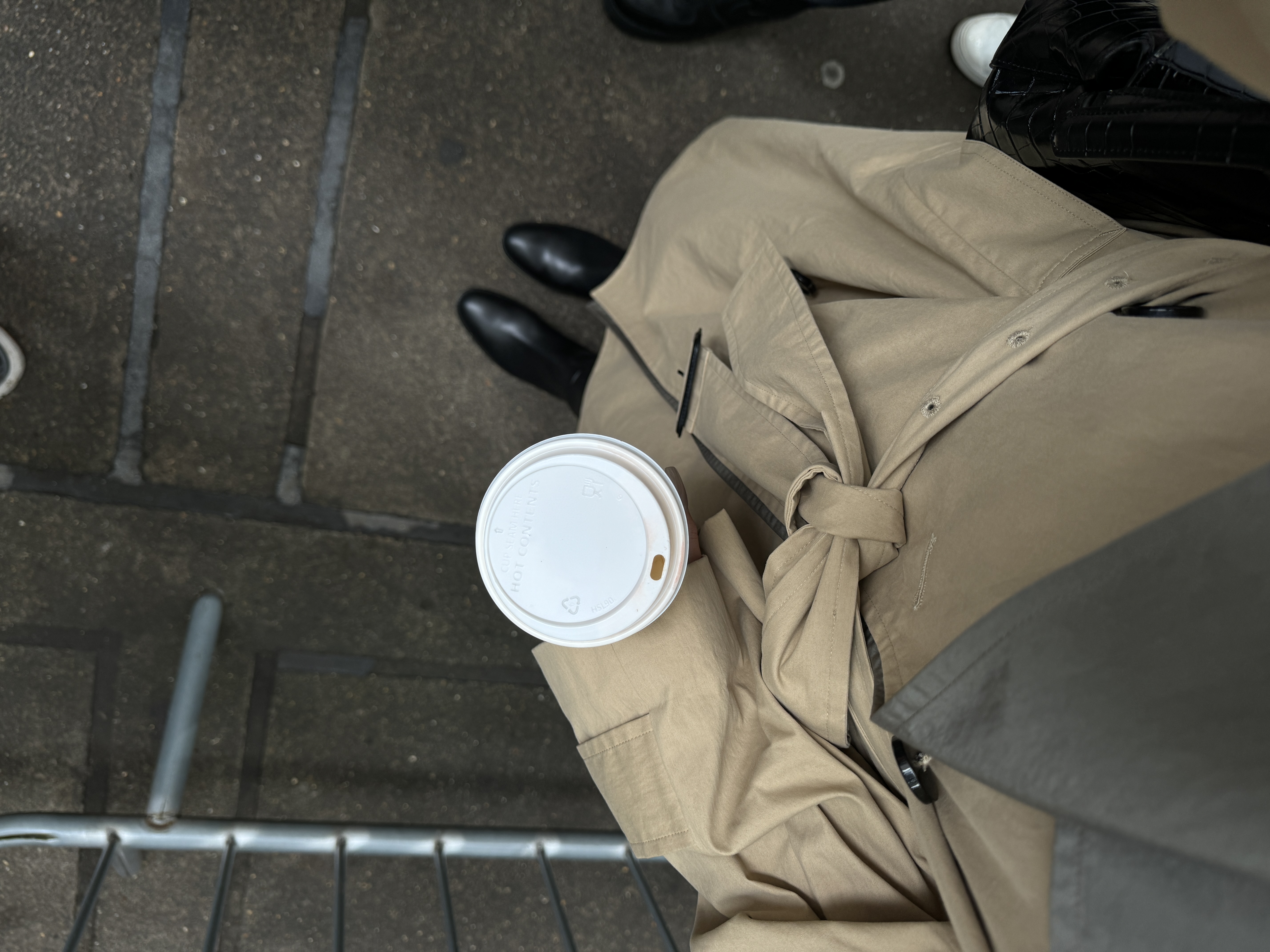 Trench coat and coffee detail