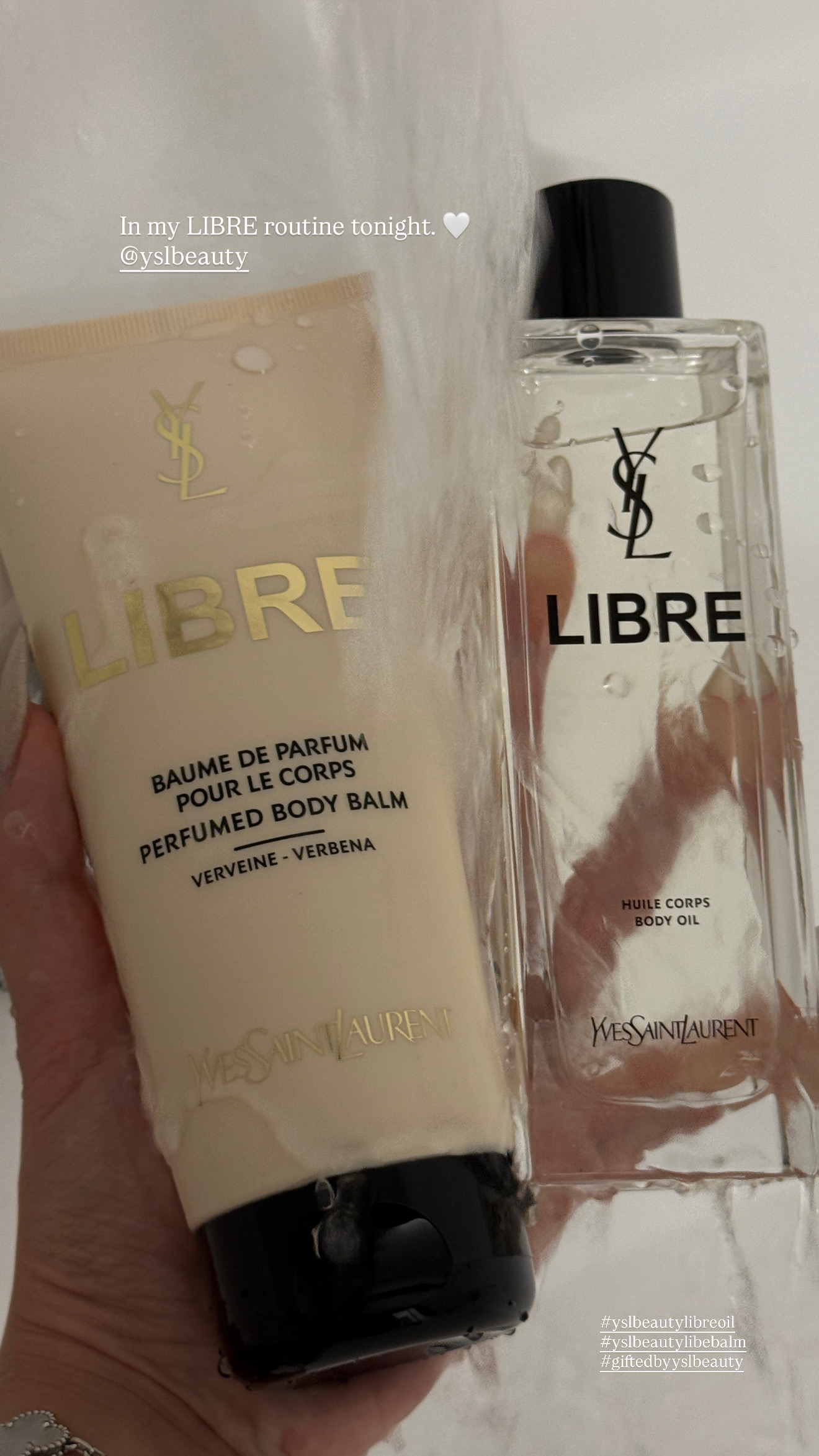 YSL Libre body products held under water